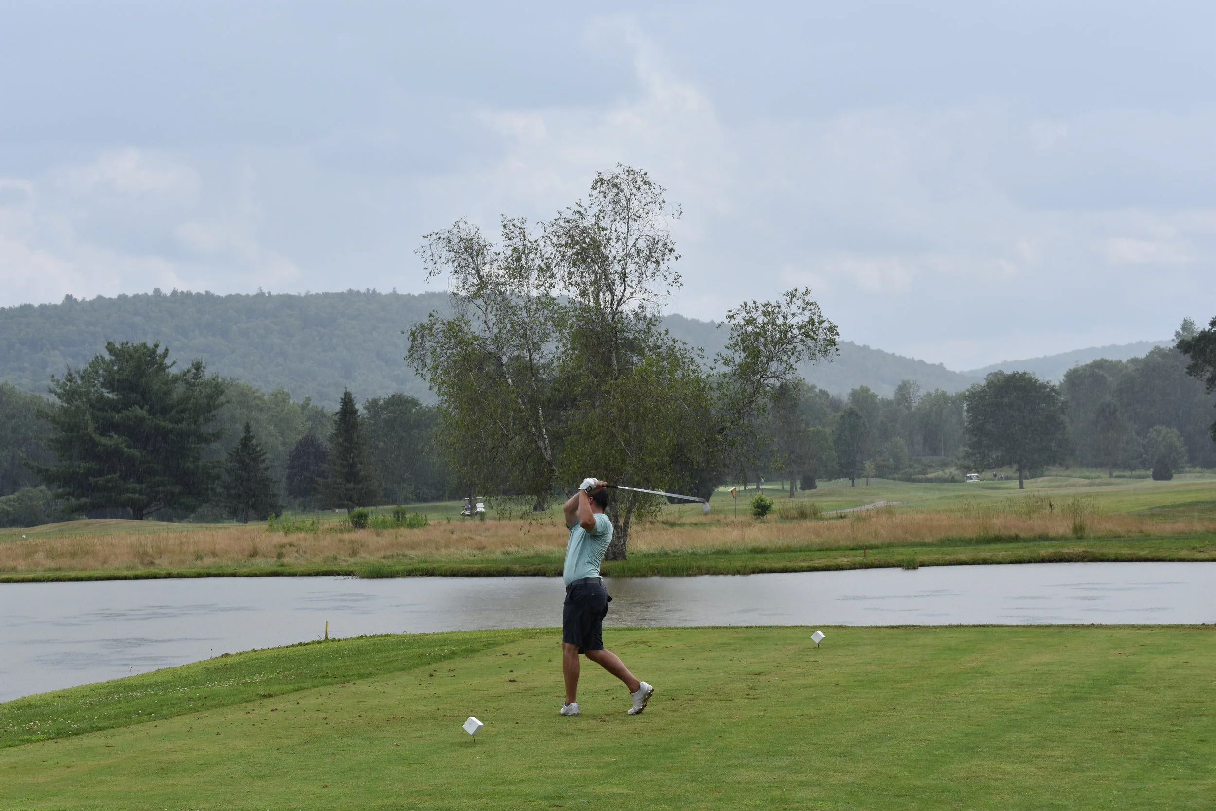Golfer on the tee box on an overcast day