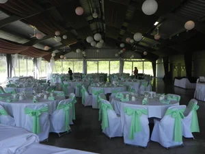 Mint chair sashes with white paper lanterns in the pavilion